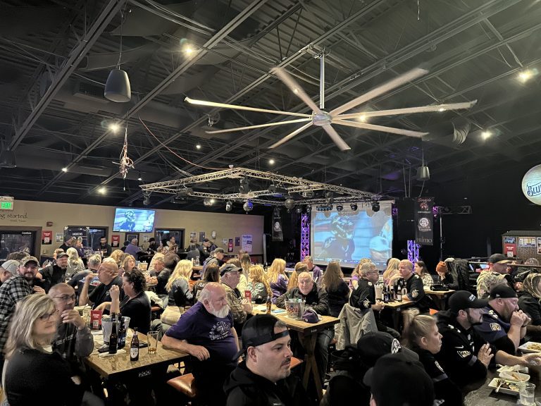 Packed room of Ravens fans watching the game at Twain's Tavern