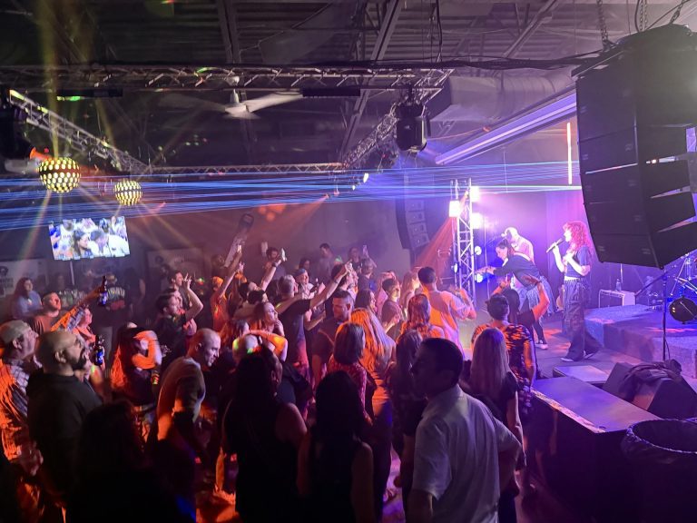 A crowd dancing in front of the stage at Twain's Tavern