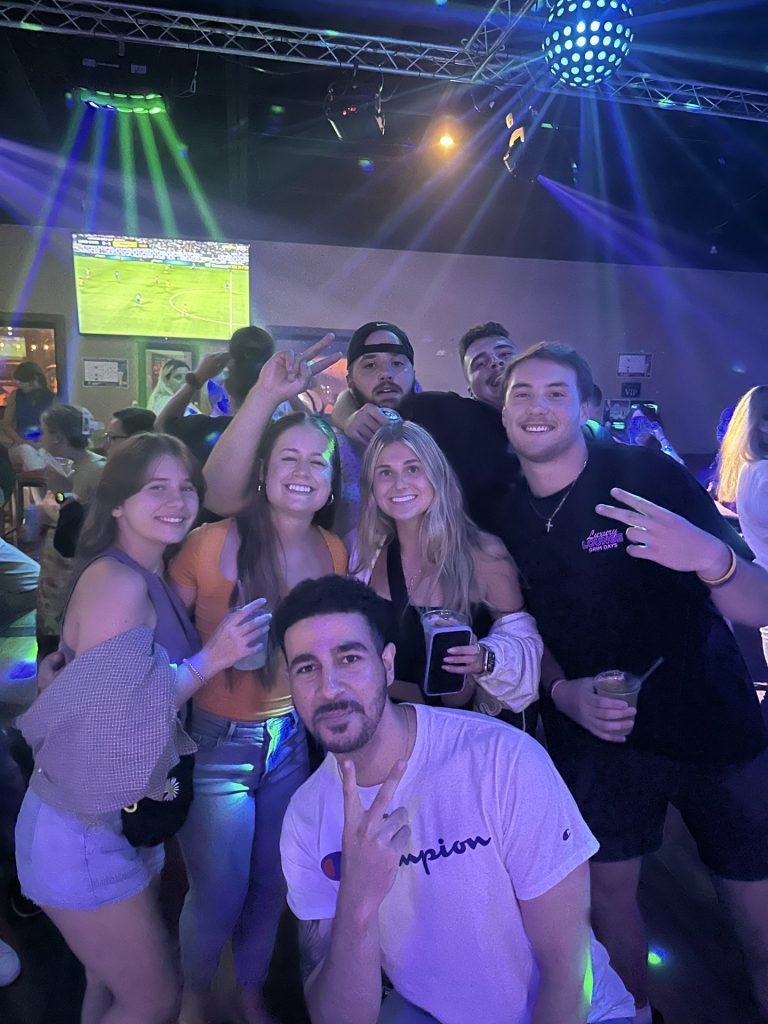 Friends under the disco ball at Twain's Tavern