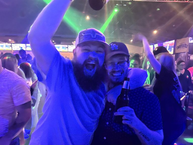 Friends cheering on a big night at Twain's Tavern