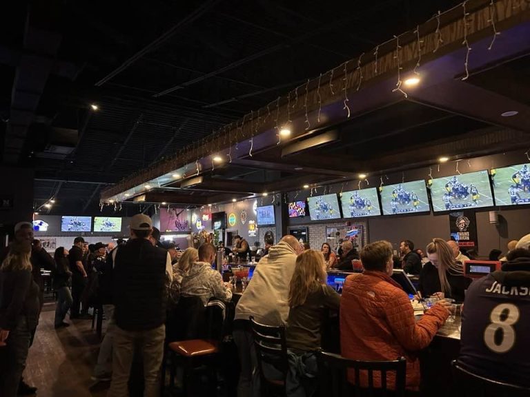The bar and wall of TVs during a Ravens game at Twain's Tavern